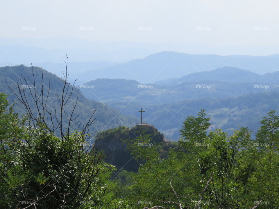 Mountain landscape and cross
