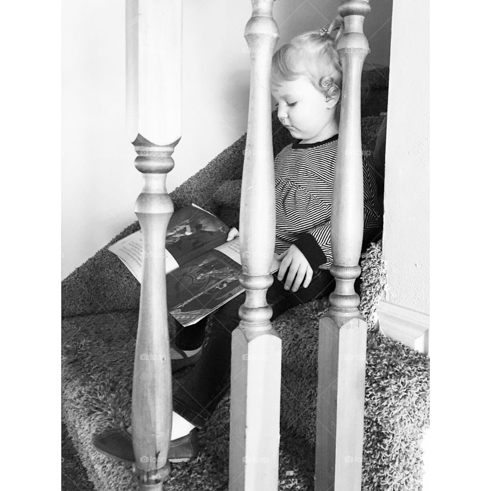 Reading books on the stairs