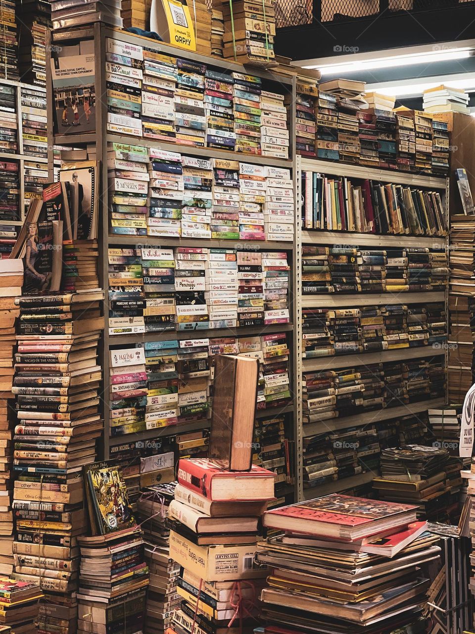Stacked of books in a used bookstore. Hundreds of books to be sell.