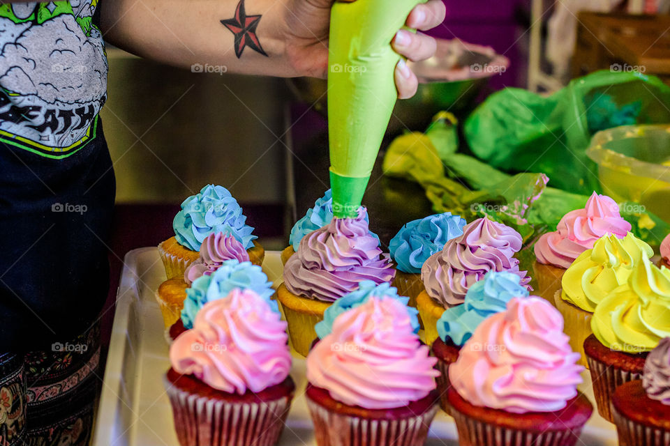 Frosting the cupcakes