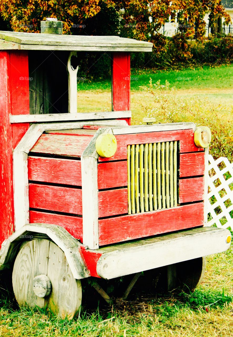 Old wooden vehicle in grass