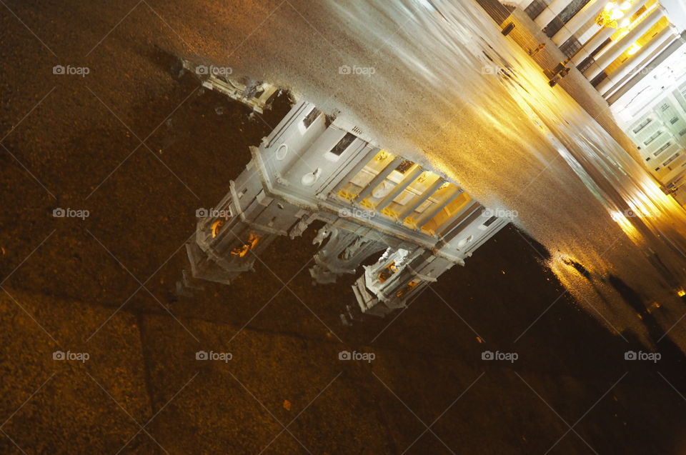 Almudena Cathedral. Reflection on a puddle. Madrid Cathedral. Spain