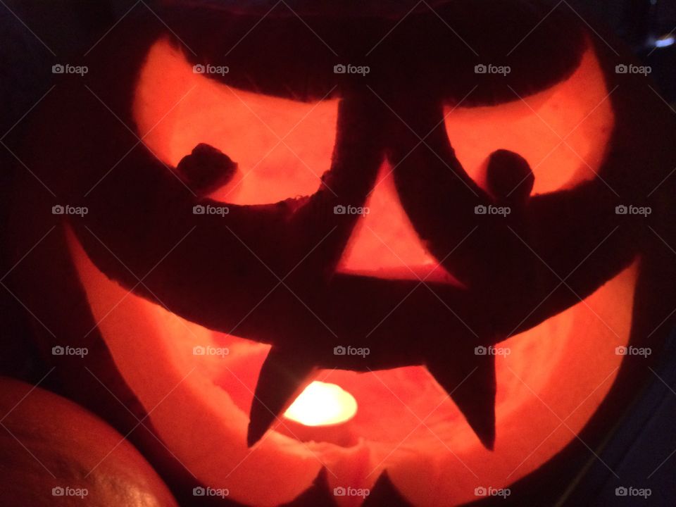 Halloween pumpkin face. Spooky carving. 