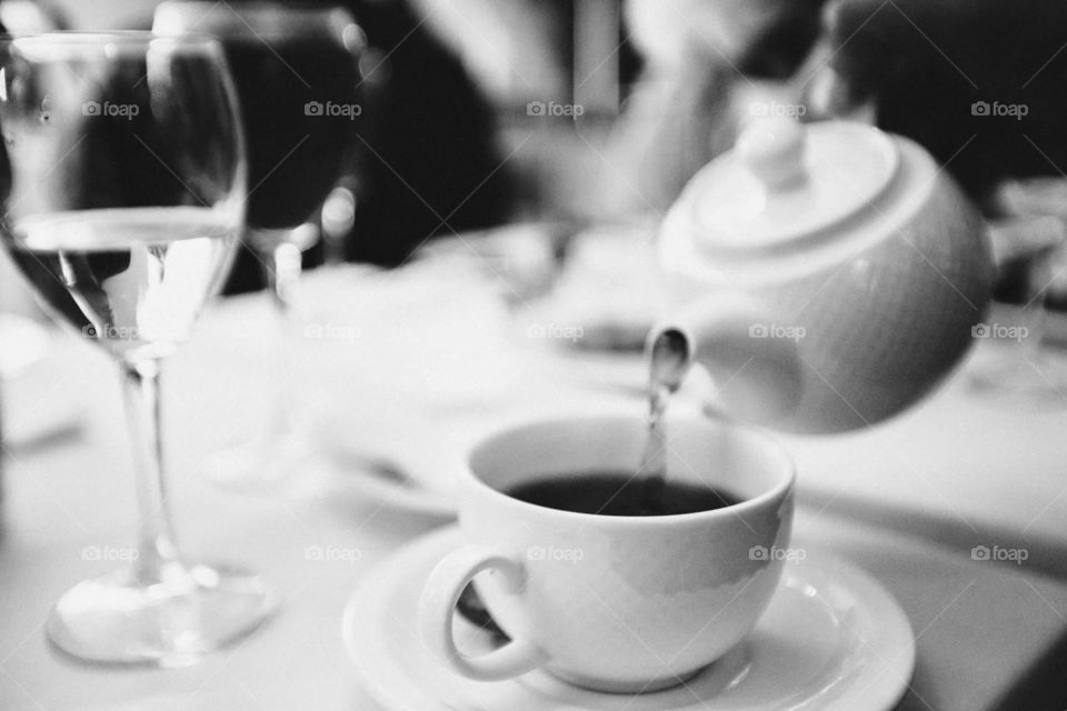 A tee pot and a tee cup on a wedding reception 