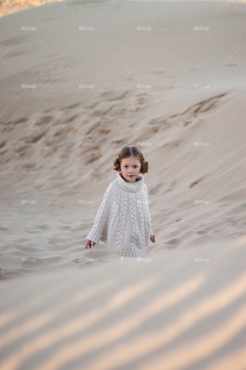 Portrait of a girl in sand dunes