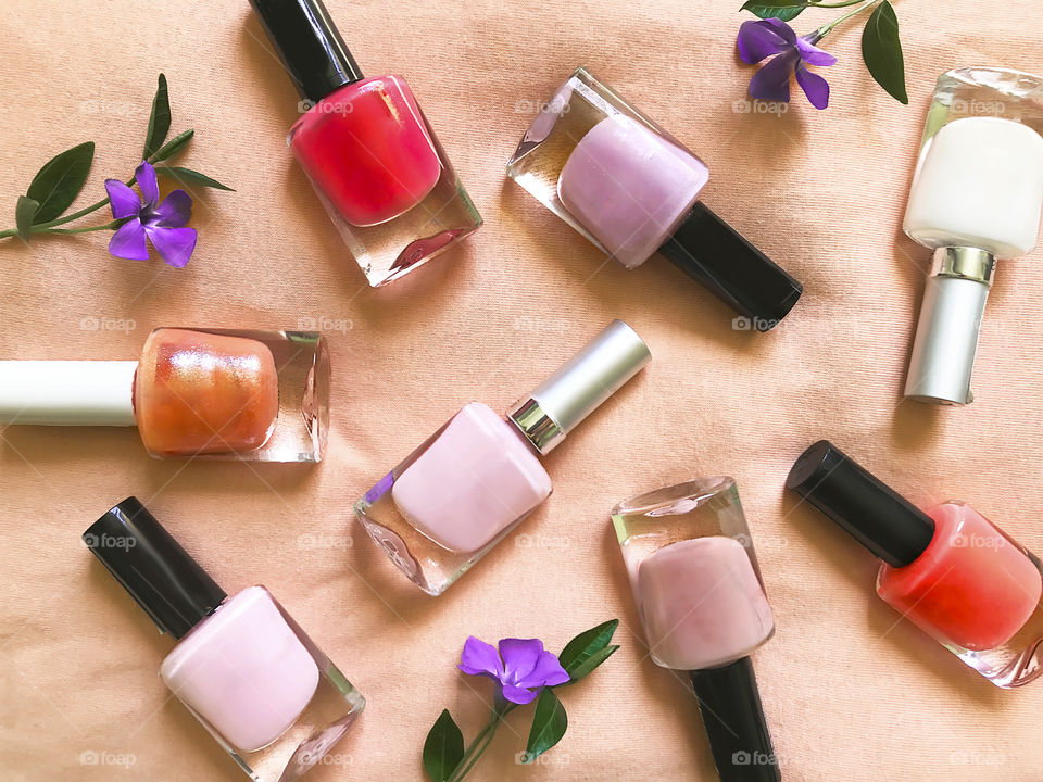 Eight colorful nail polish bottles 