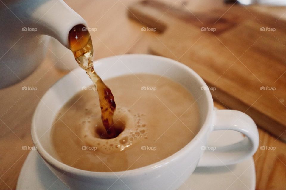 Tea poured into cup of English tea