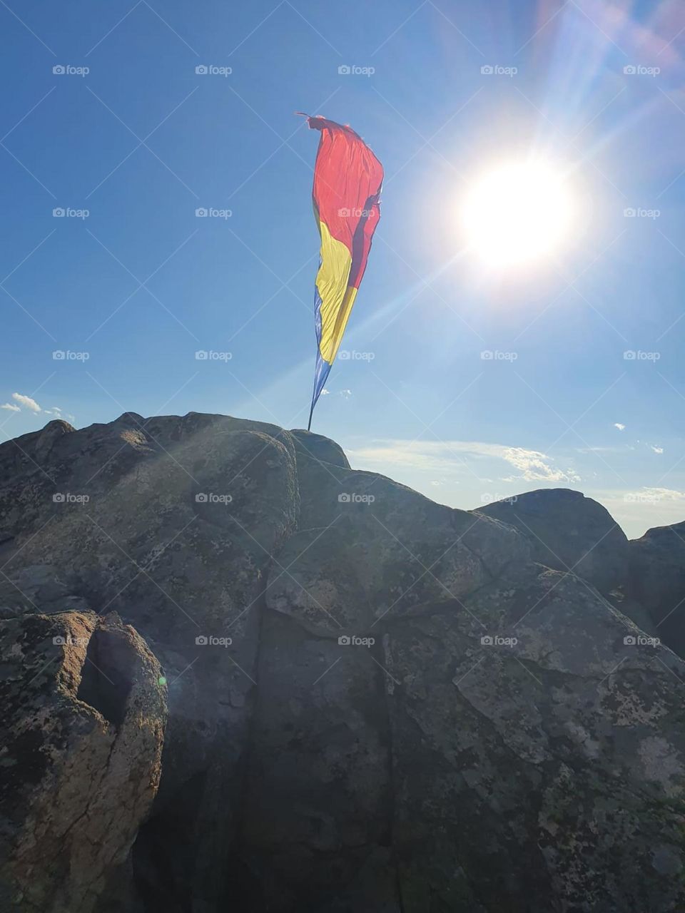 Romanian flag on the top of mountains