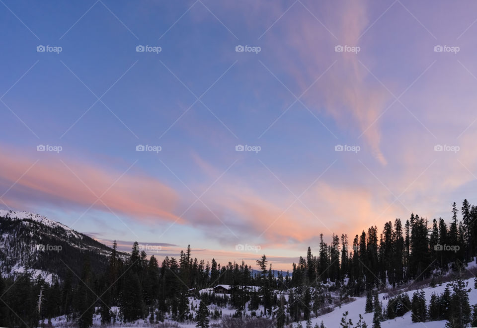 Panoramic beautiful view of winter landscape in the mountains during colorful sunset time