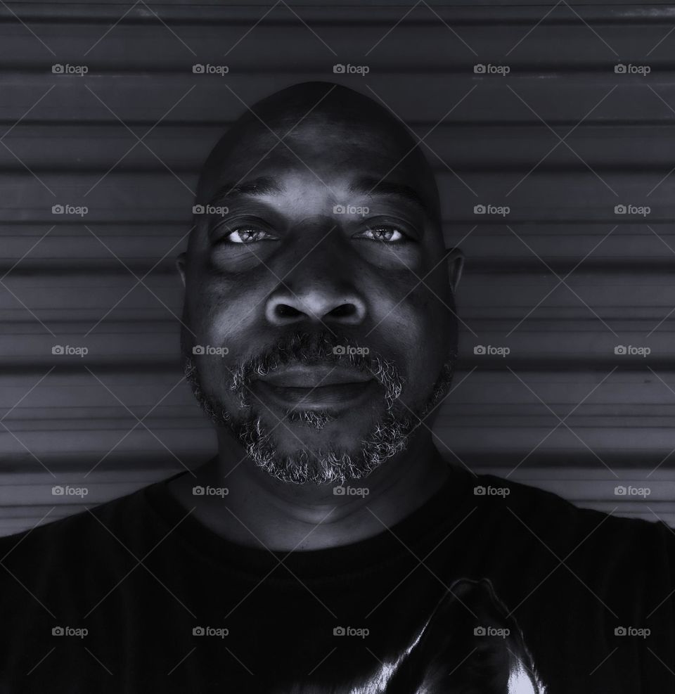 black and white selfie portrait with dark background