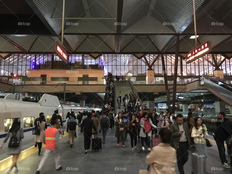 It’s 8:00PM on a Friday night, and the Suzhou Railway Station is at its busiest. Though Suzhou is famous for its beautiful ancient gardens and canals, in the past 20 years also it has become a hub for manufacturing. High speed trains between Shanghai and Nanjing (The capital of Jiangsu Province, which Suzhou is part of) make a stop at the station roughly every 5 minutes from 5:00PM to 8:30PM, hailing people home for the weekend before the rush begins again on Monday morning going to work. #Suzhou #Railway #GoingHome