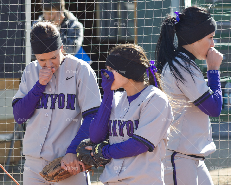 morning. players softball do their best to stay warm by arizphotog