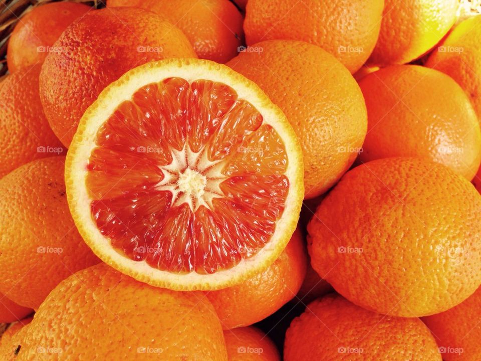 Close-up of sliced orange and oranges