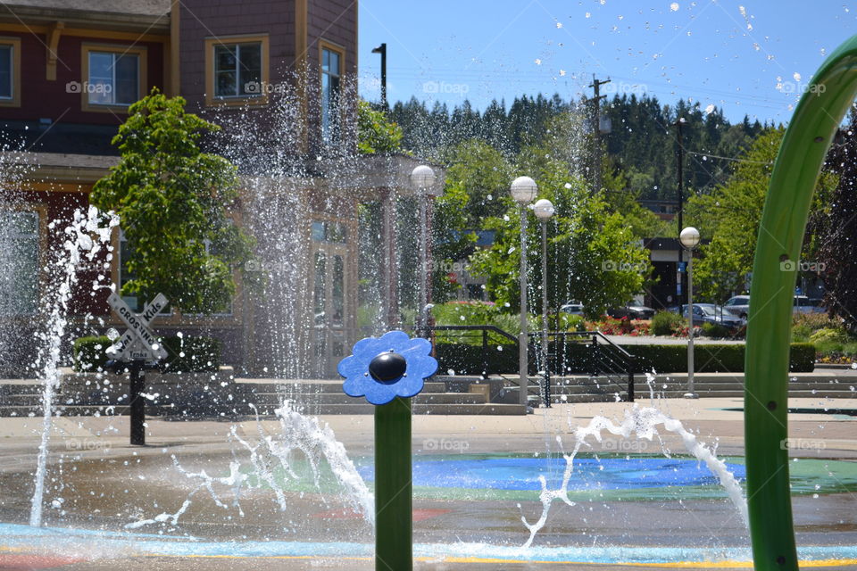 Child's waterpark water spraying 