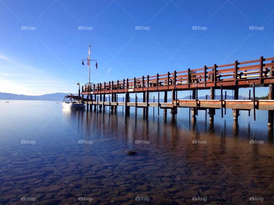 Blue water and pier