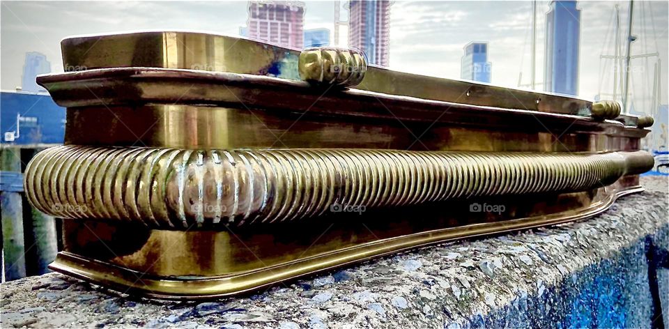 This rare design piece fit for a mansion or a castle, a beautiful bronze fireplace fender found recently on Manhattan’s Upper E Side was photographed against the Greenpoint, Bklyn shore of Newtown Creek. 2022. Hypnotic Productions