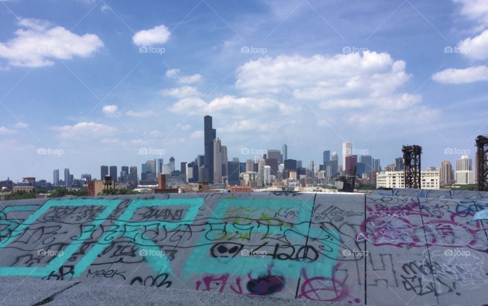 Abandoned factory in Chicago , roof top , graffiti on the roof .