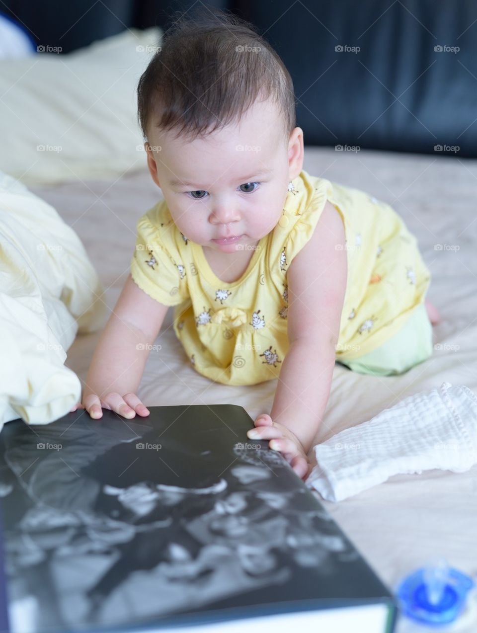 Baby girl admiring book