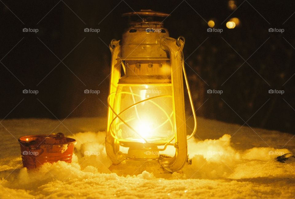warm lantern glow on a snowy night