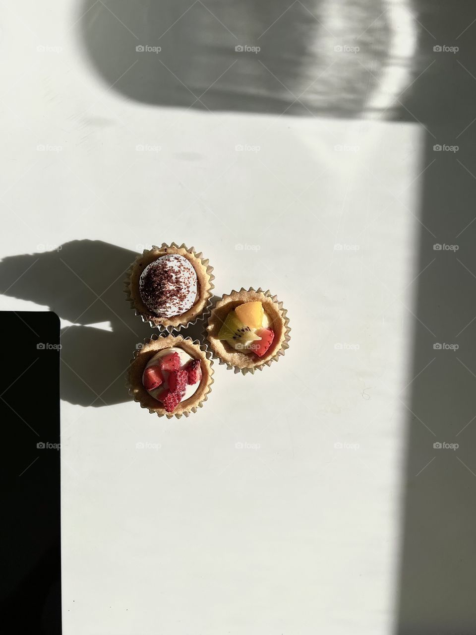 Assorted homebaked Fruit tarts and Nutella chocolate nut butter tarts 