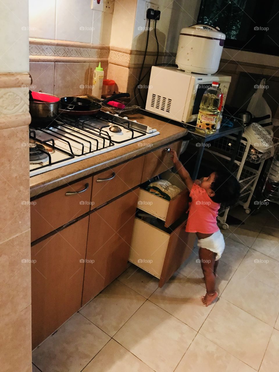 My baby catching kitchen items