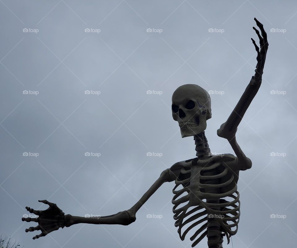 Halloween Skeleton Against a Stormy Sky
