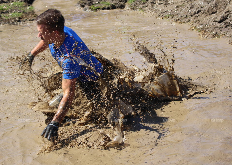 Runner in mud.