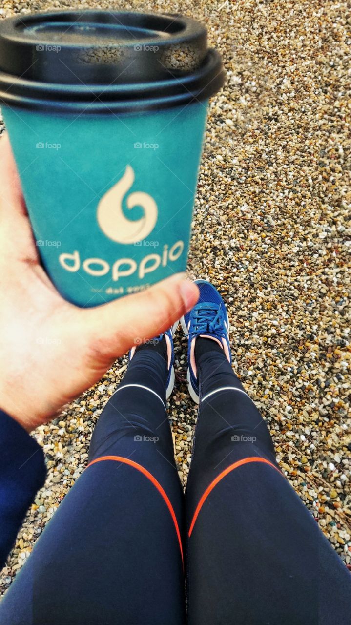 coffee in one hand . confidence in the other