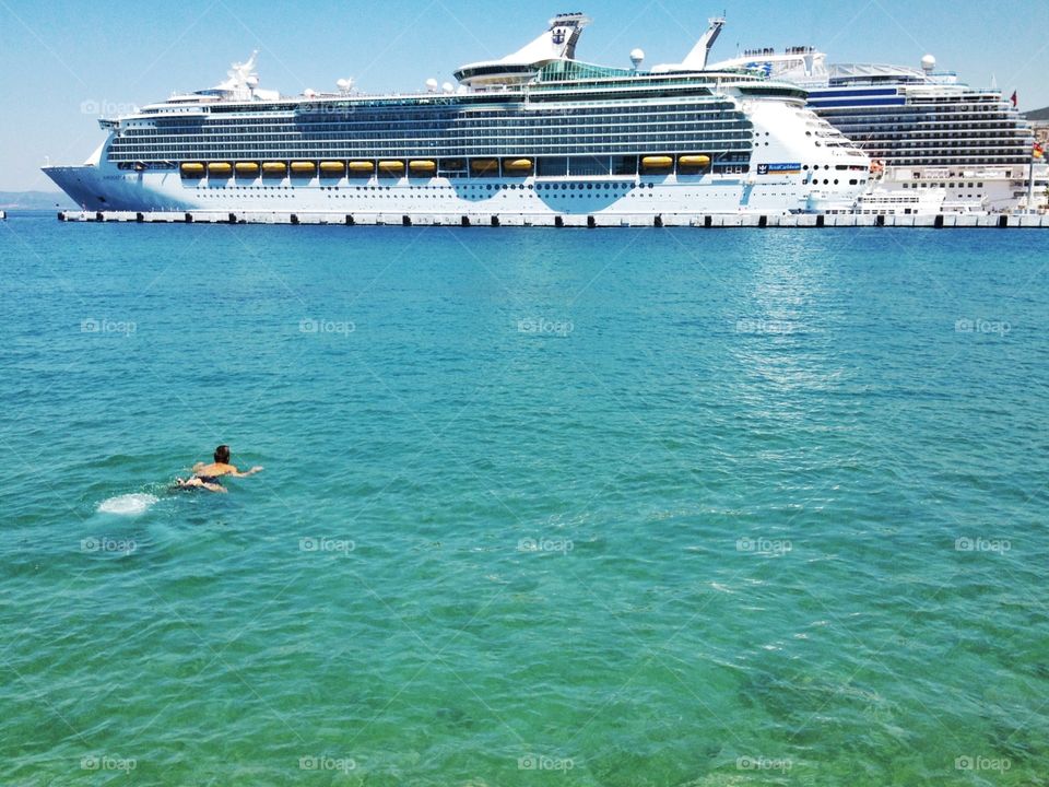 A big boat. A man is gong to go to boat 