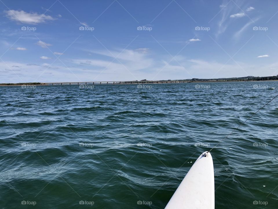 Alone on the sailing boat in the empty water