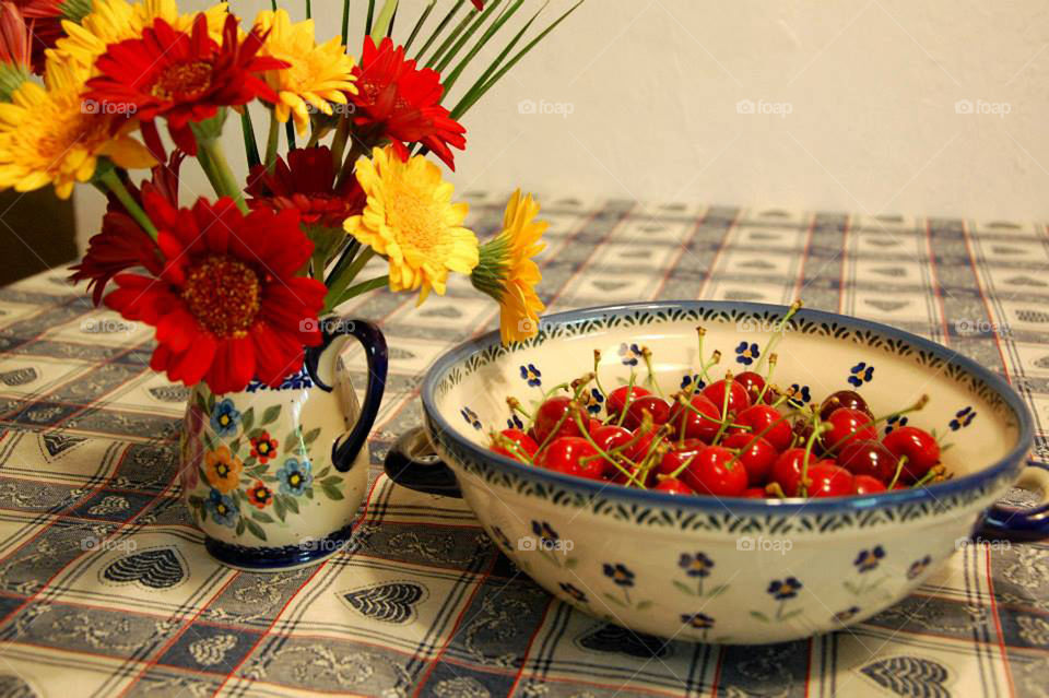 Cherries and flowers. 