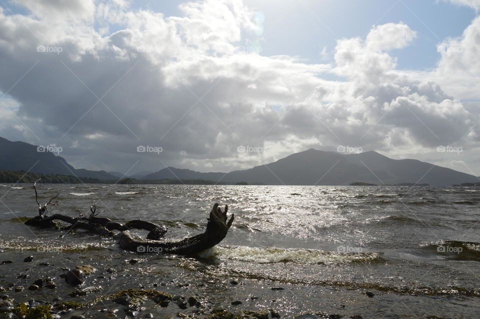 afternoon at the lake with cloudy sky