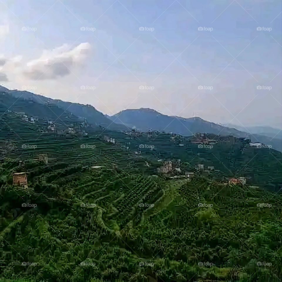 Glory be to God, the magnificent and picturesque view and the natural green trees are a view that is nothing more wonderful than it