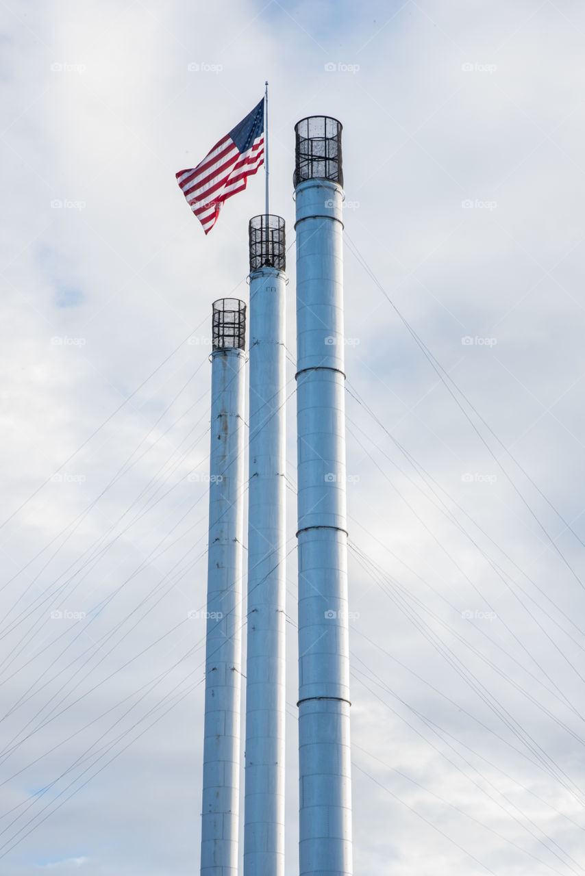 American Flag on top of smoke stacks in Bend Oregon