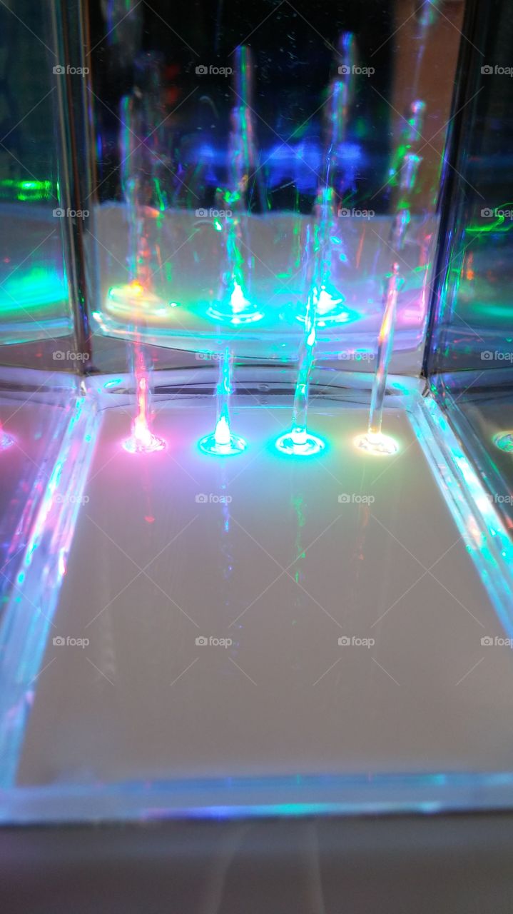 colored light beams. tried to take a pic of my water speakers playing music