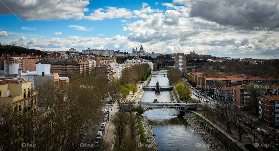 High angle view of canal against cloudy sky