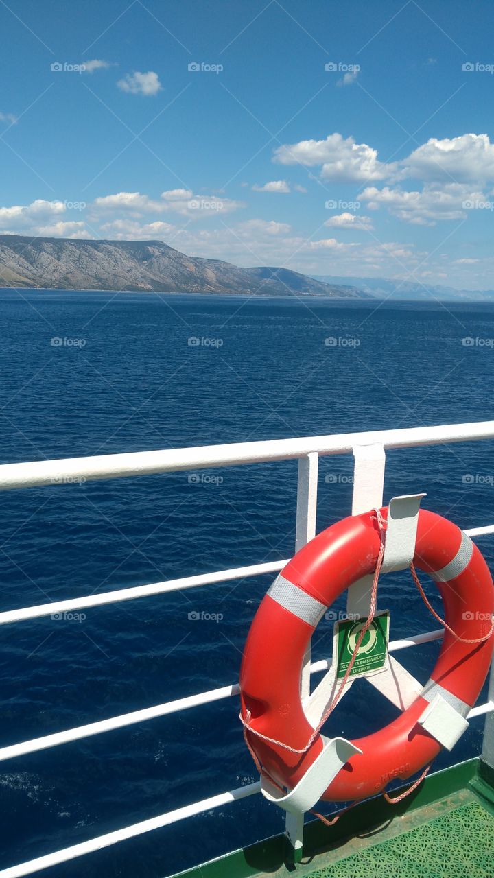 The Lifebuoy on the Ferry and the View at the Islands, and the Sea in Croatia.