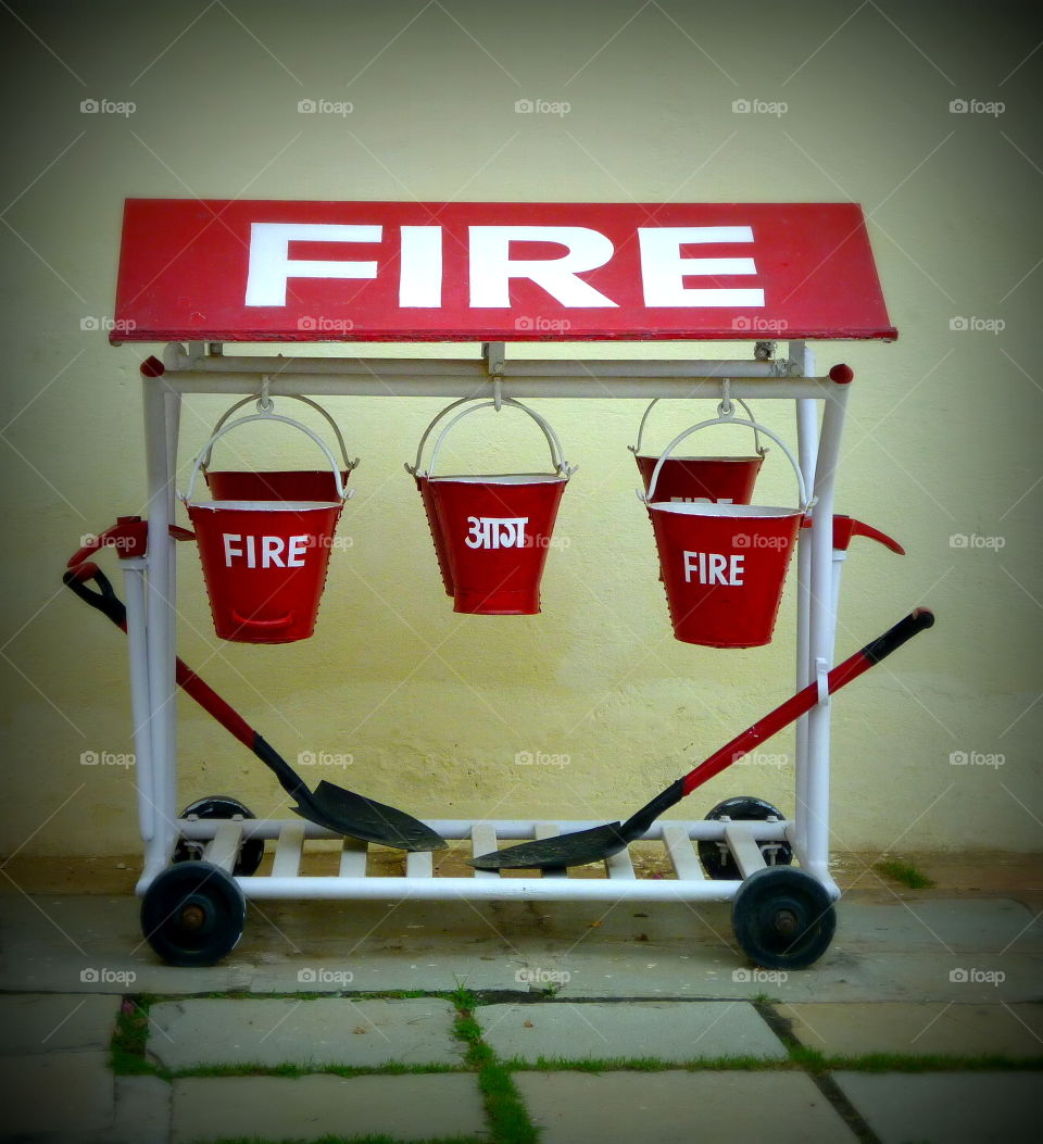 in case of fire: red buckets with sand