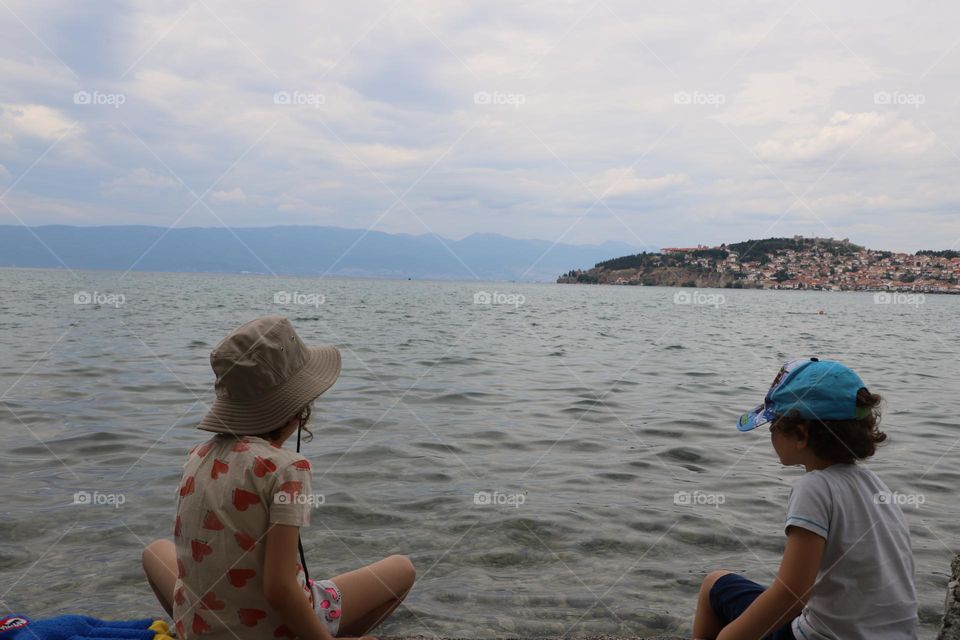 kids cooling by the lake 