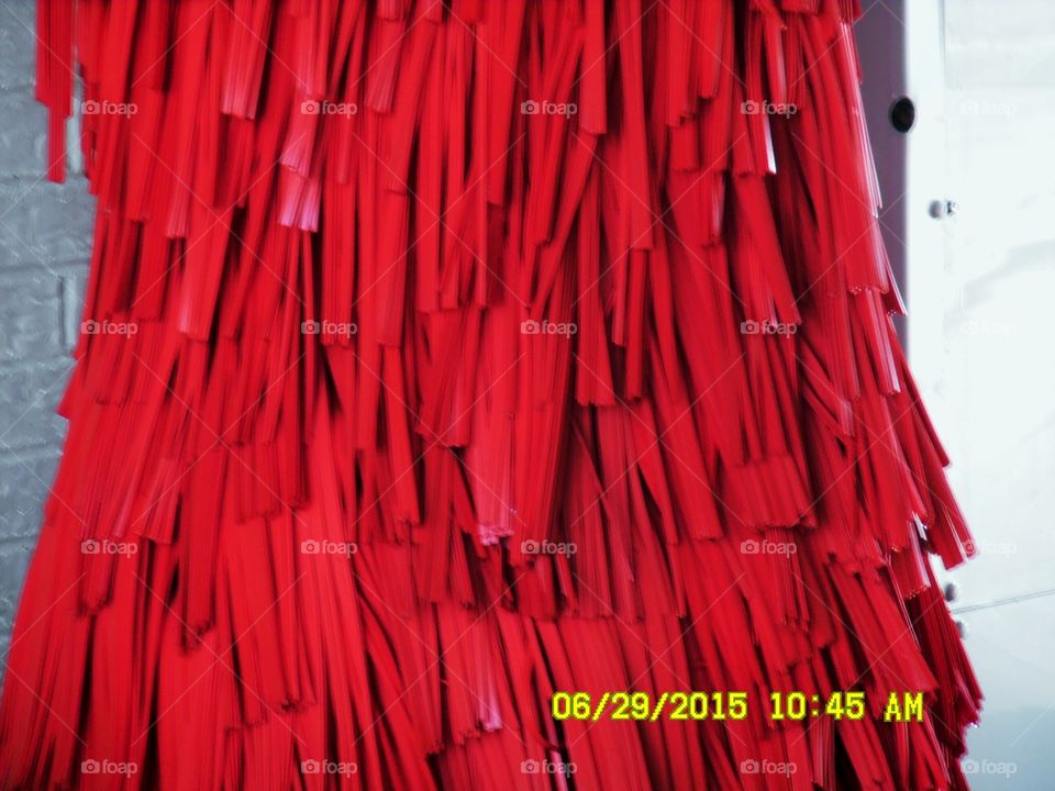 Cousin It. This is a picture that looks like cousin it off of the show the Adams family 👪 only this it is red