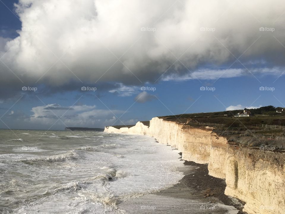 Cloudy seashore cliffs