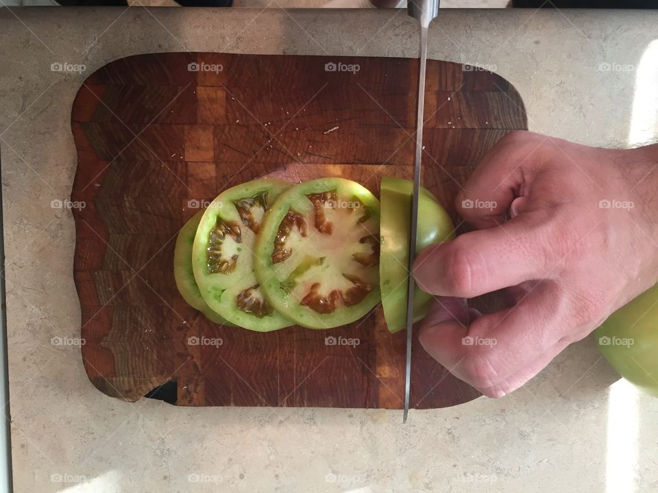 Cutting green tomatoes