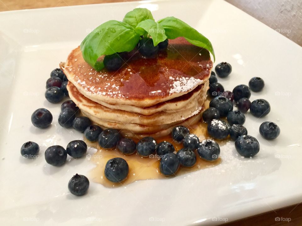 Bourbon Vanilla Almond Pancakes with Maple Syrup & enjoyed with blueberries 