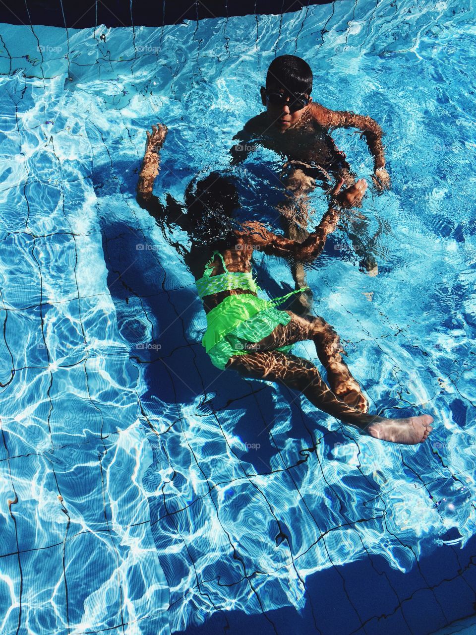 Elevated view of children in swimming pool