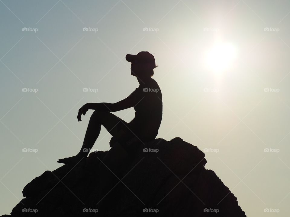 A silhouette photo trying to play with the sun. It was taken while I was traveling to the south of Thailand