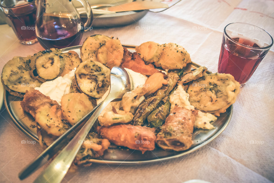 Fried zucchini with red wine