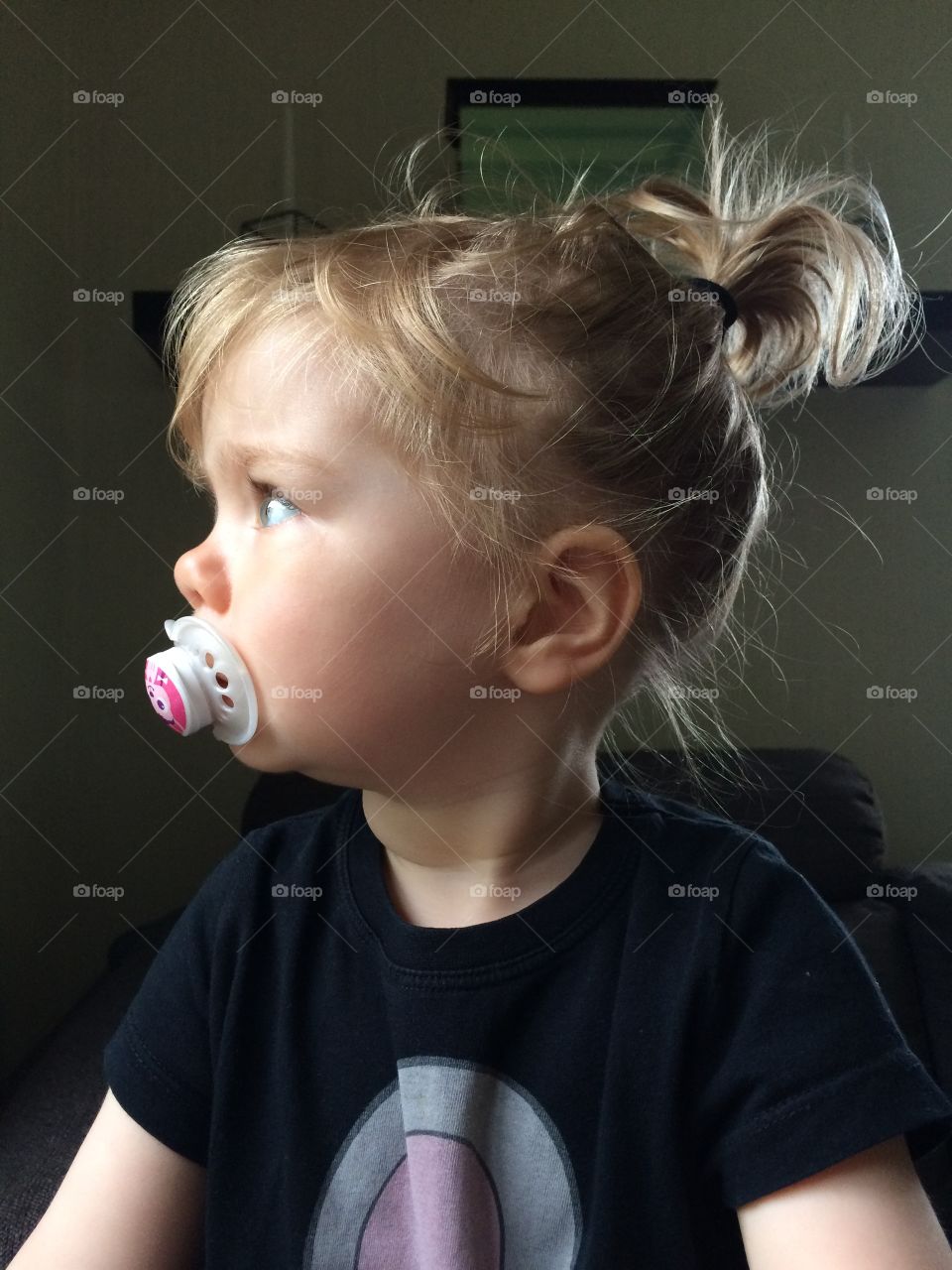 Close-up of small child with pacifier