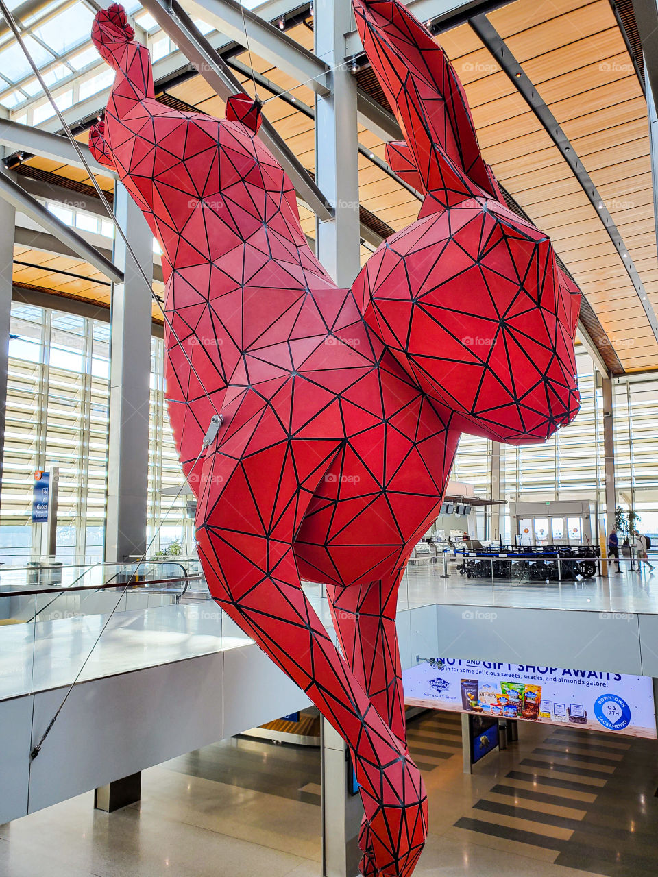 A massive red rabbit greets travelers at the Sacramento California Airport