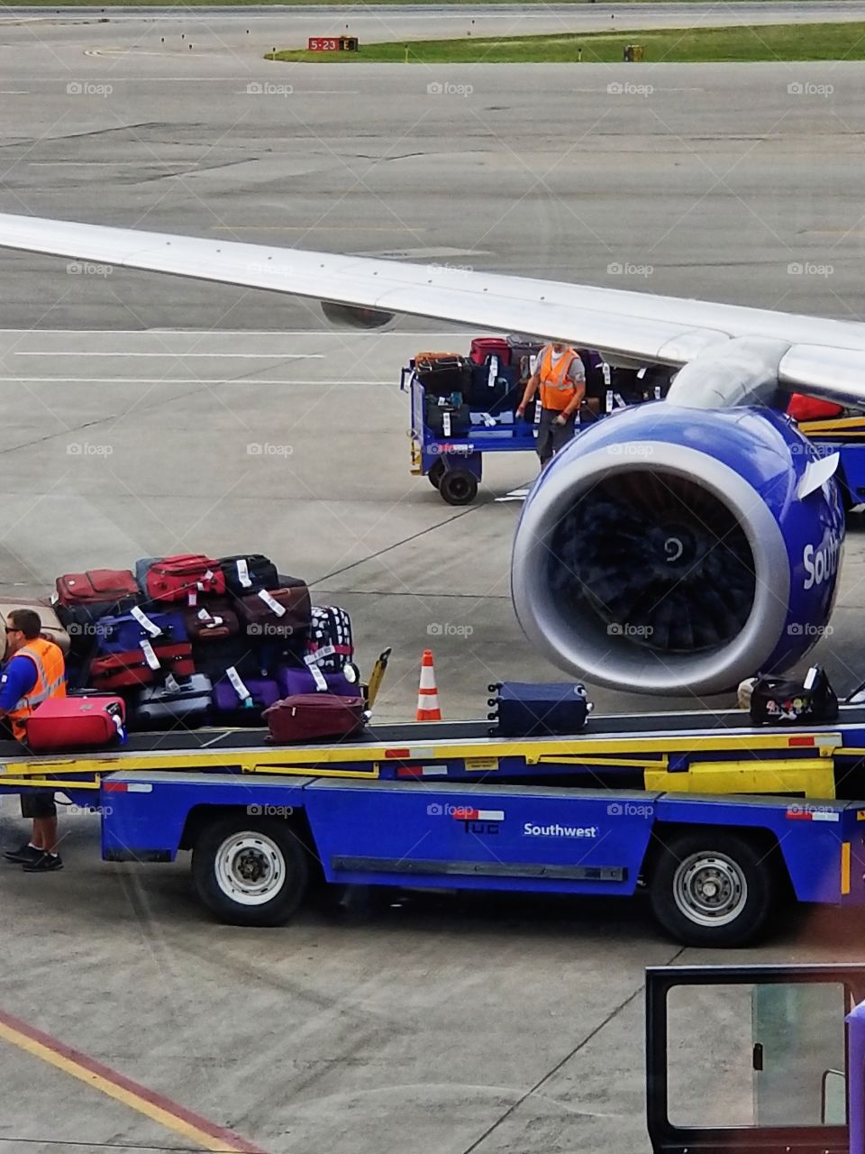 Loading  luggage into plane