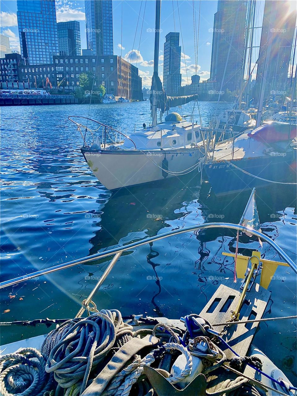 The boats at “Newtown Creek” by the “Pulaski Bridge” in LIC, Queens are most beautiful to behold in the golden glow of the evening sun. 2023. Hypnotic Productions